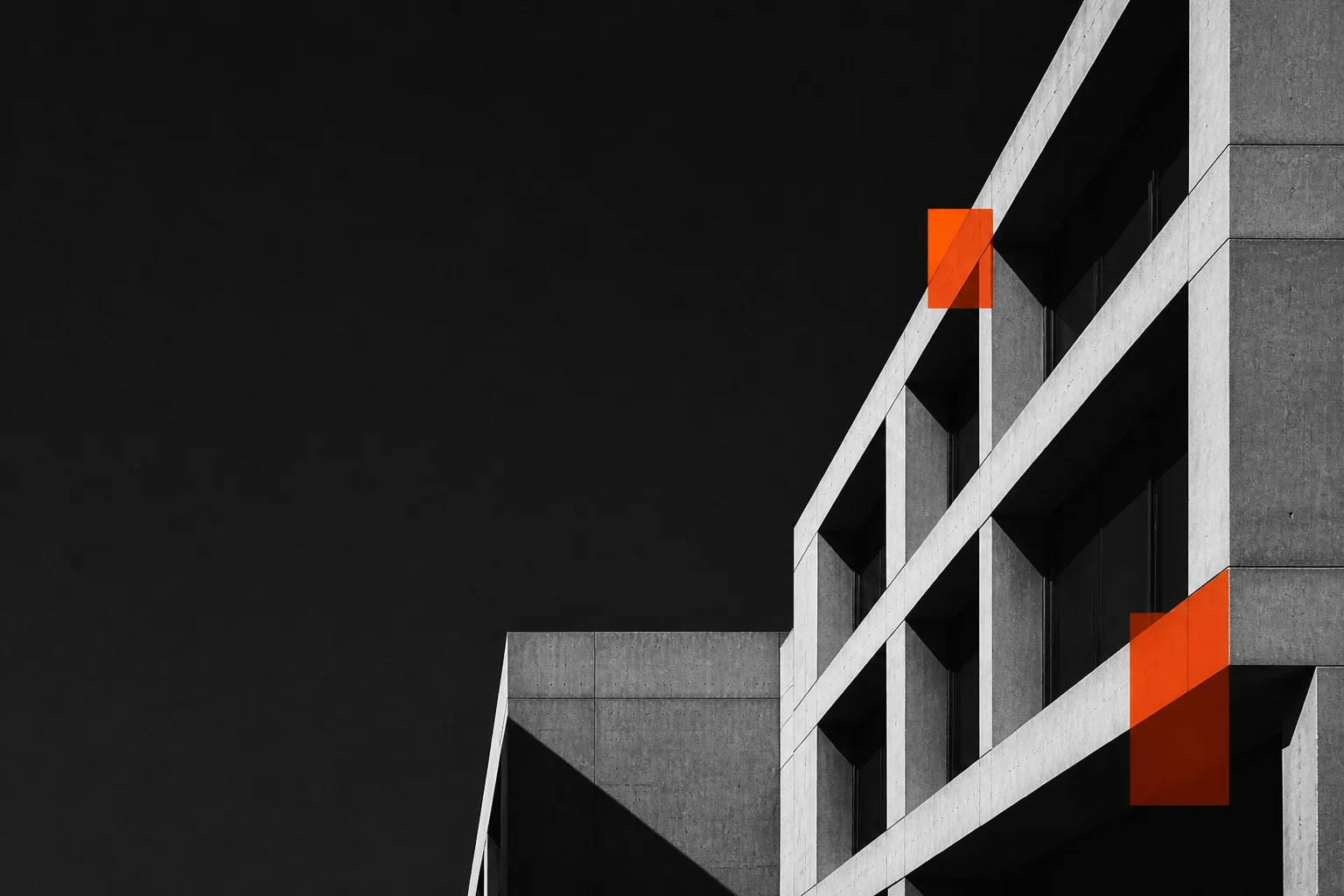 Modern concrete architecture with orange modular overlays