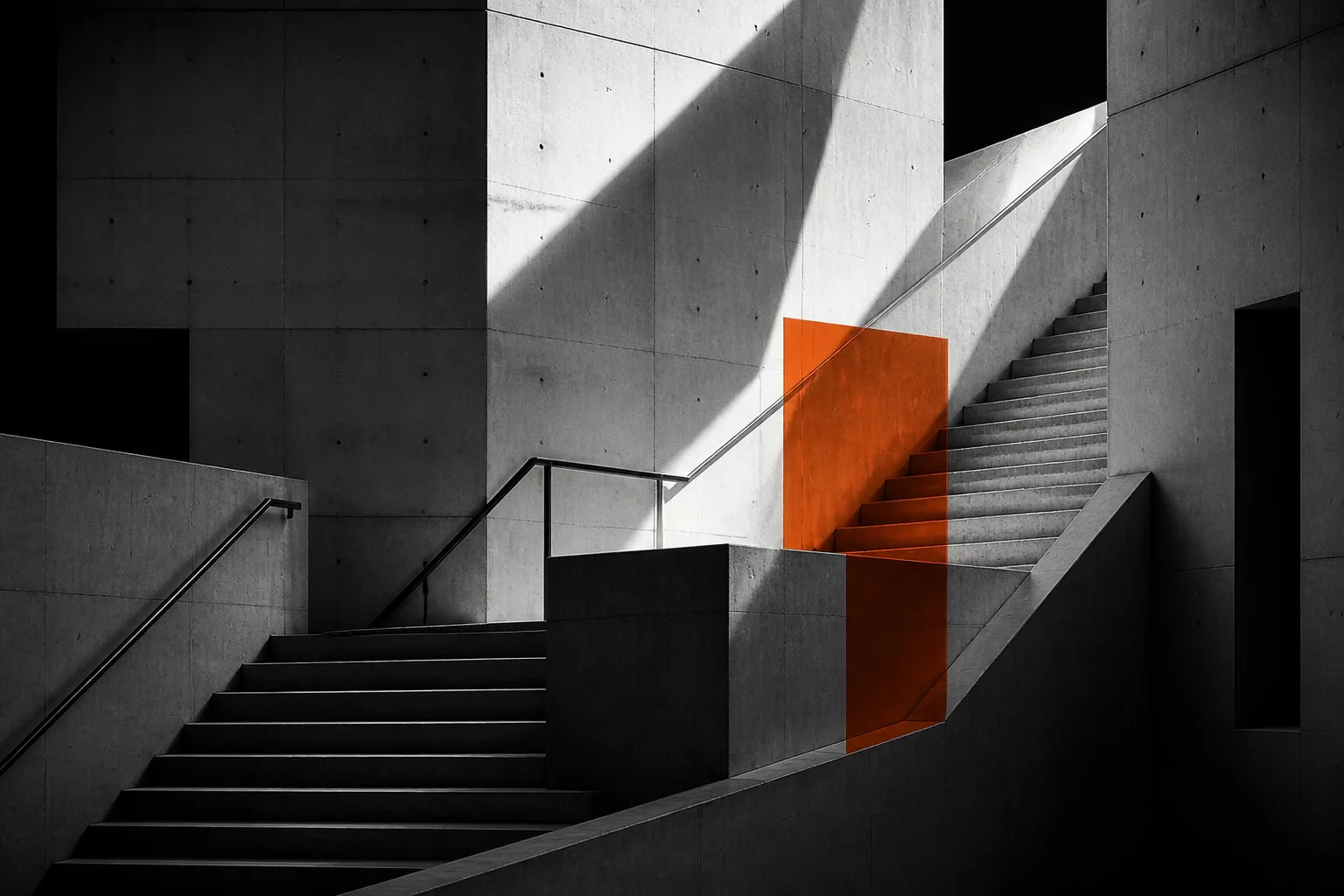 Modern concrete staircase with orange structural overlay